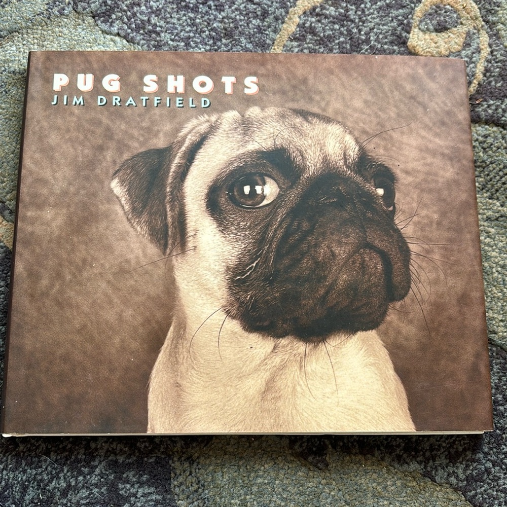 Wonderful entertaining for that Pug collection. Book with pictures of Pugs